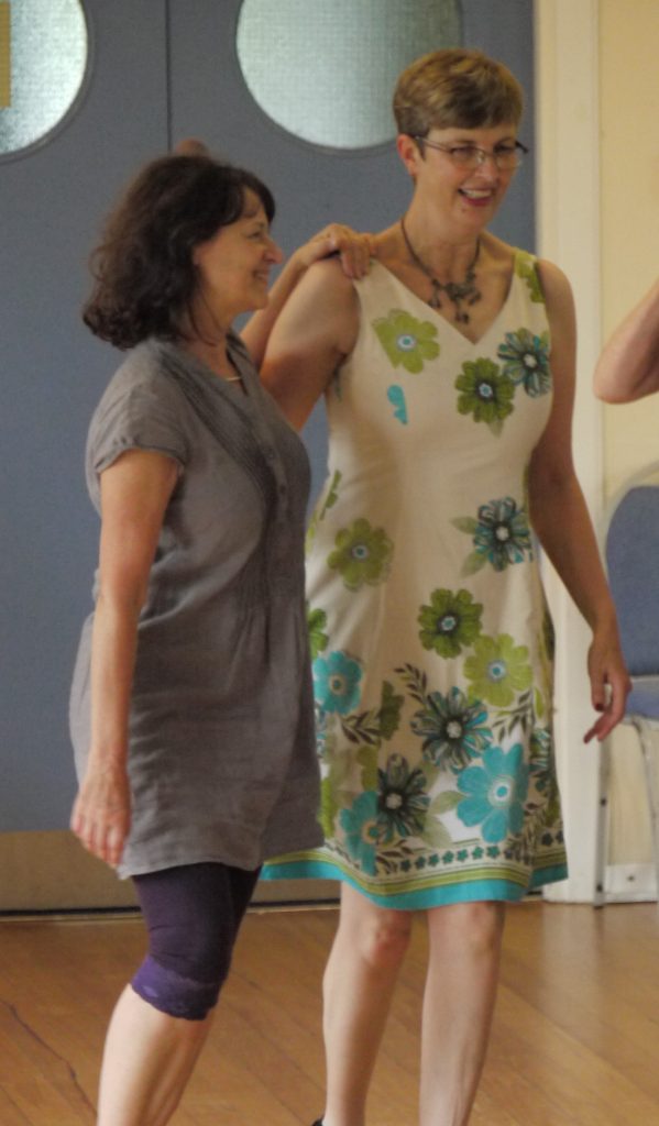 Two women dancing together, Maggie Daniel is on the right.